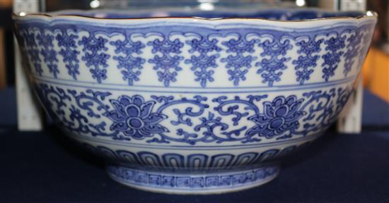 An unusual large Japanese Arita blue and white Kakiemon style bowl, Qianlong mark, 19th century, 30cm, hairline crack